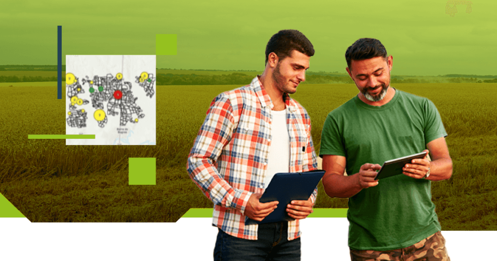 Dois homens em um campo de cultivo utilizando tablets e pranchetas para coletar dados, com um mapa interativo ao fundo mostrando pontos de interesse. A cena reflete o uso de tecnologia GIS para monitoramento e gestão de áreas rurais, simbolizando o uso do Sistema ArcGIS no agronegócio.